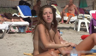 Sexy teens flashing their natural tits at the nude beach