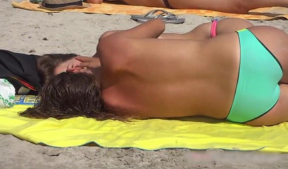 Sexy teens flashing their natural tits at the nude beach