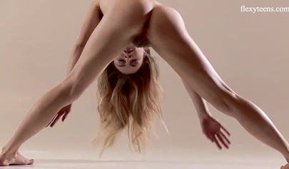 Stunning ballerina teen with an amazing body stripping and stretching