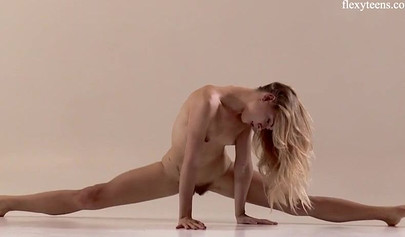 Stunning ballerina teen with an amazing body stripping and stretching