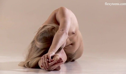 Stunning ballerina teen with an amazing body stripping and stretching