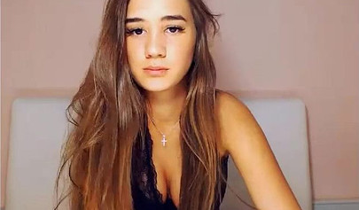 Beautiful brunette teen with big tits stripping and posing on cam