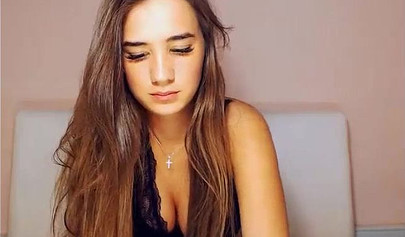 Beautiful brunette teen with big tits stripping and posing on cam