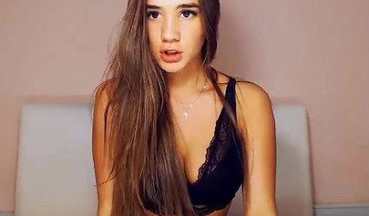 Beautiful brunette teen with big tits stripping and posing on cam