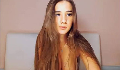 Beautiful brunette teen with big tits stripping and posing on cam