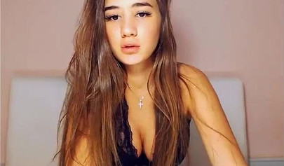 Beautiful brunette teen with big tits stripping and posing on cam