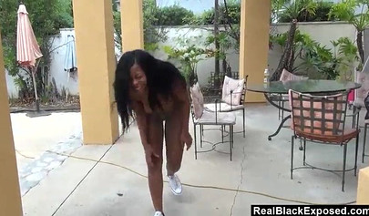 Black teen with big tits deepthroats a white dick outdoors