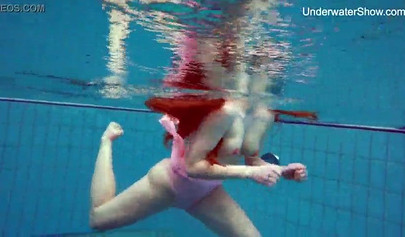 Redhead teen strips naked at the pool and shows her innocent body