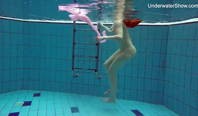 Redhead teen strips naked at the pool and shows her innocent body