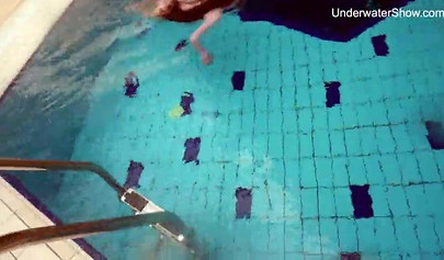 Redhead teen strips naked at the pool and shows her innocent body