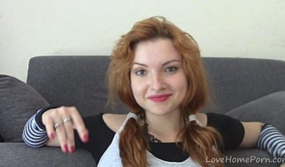 Ginger teen with big tits playing with her snatch on the sofa