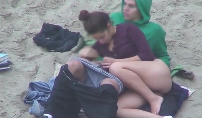 Hot brunette teen caught riding a dick on the sandy beach