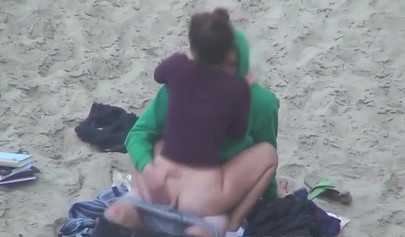 Hot brunette teen caught riding a dick on the sandy beach