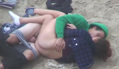 Hot brunette teen caught riding a dick on the sandy beach