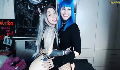 Two teenage Goth sluts lick each other's nipples on cam