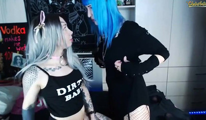 Two teenage Goth sluts lick each other's nipples on cam