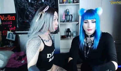 Two teenage Goth sluts lick each other's nipples on cam