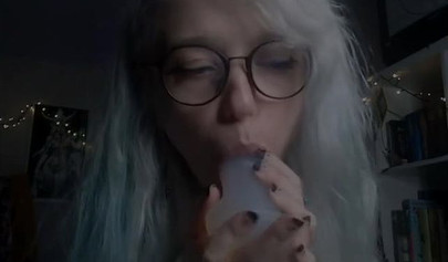 Teenage nerd shows her tiny tits and sucks a plastic dick