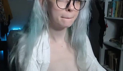 Teenage nerd shows her tiny tits and sucks a plastic dick