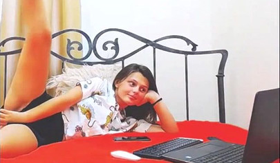 Adorable teen babe posing on camera in her sexy outfit