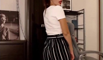 Adorable teen babe posing on camera in her sexy outfit