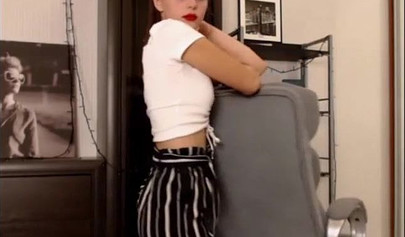 Adorable teen babe posing on camera in her sexy outfit