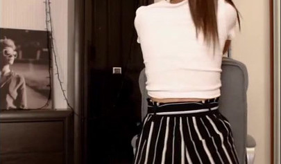 Adorable teen babe posing on camera in her sexy outfit