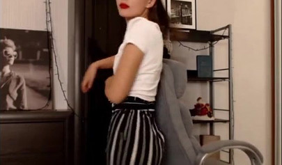 Adorable teen babe posing on camera in her sexy outfit