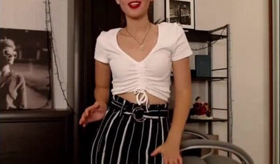 Adorable teen babe posing on camera in her sexy outfit