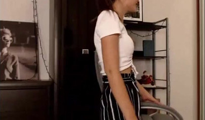 Adorable teen babe posing on camera in her sexy outfit