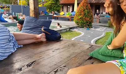 Pantyless teen in sexy summer dress flashes her trimmed pussy in public