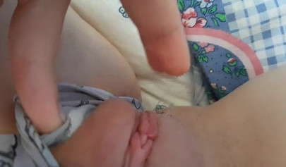 Lonely teen babe removes her panties and rubs her bald pussy