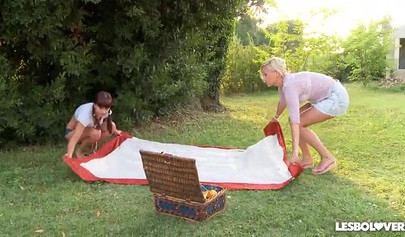 Three lesbian teens lick each other's feet outdoors