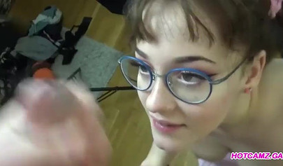 Nerdy teen with big tits giving mind-blowing head in POV