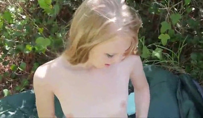 Blonde teen Lily Rader rubs and dildos her pink pussy outside