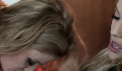 Mom Angela Sommers and her stepdaughter Kenna James scissor on the bed