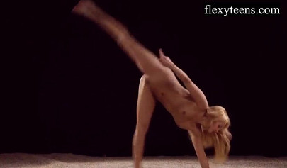 Sexy blonde teen with big tits dances provocatively butt naked