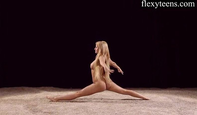 Sexy blonde teen with big tits dances provocatively butt naked