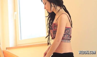 Sexy Emo teen strips on the stairs and shows her perky medium tits