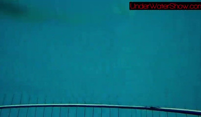 Gorgeous teen strips naked while swimming in the pool