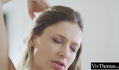 Adorable lesbian teens massage each other's hot pussies on the bed