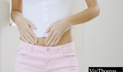 Adorable lesbian teens massage each other's hot pussies on the bed