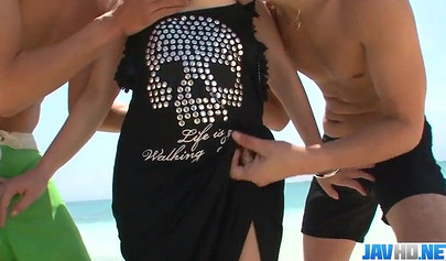 Sexy Japanese teen Mayuka Akimoto has hardcore sex on the sandy beach